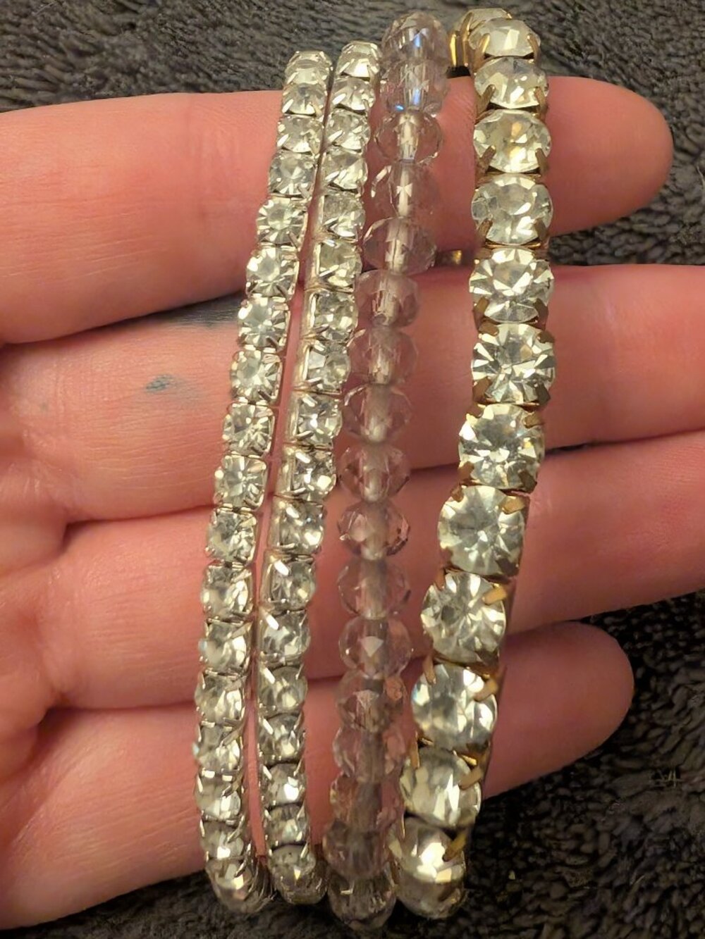 Set of 3 stacked rhinestone and gold tone bracelets